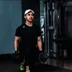 Strength trainer Arjun Thapa holding dumbbells