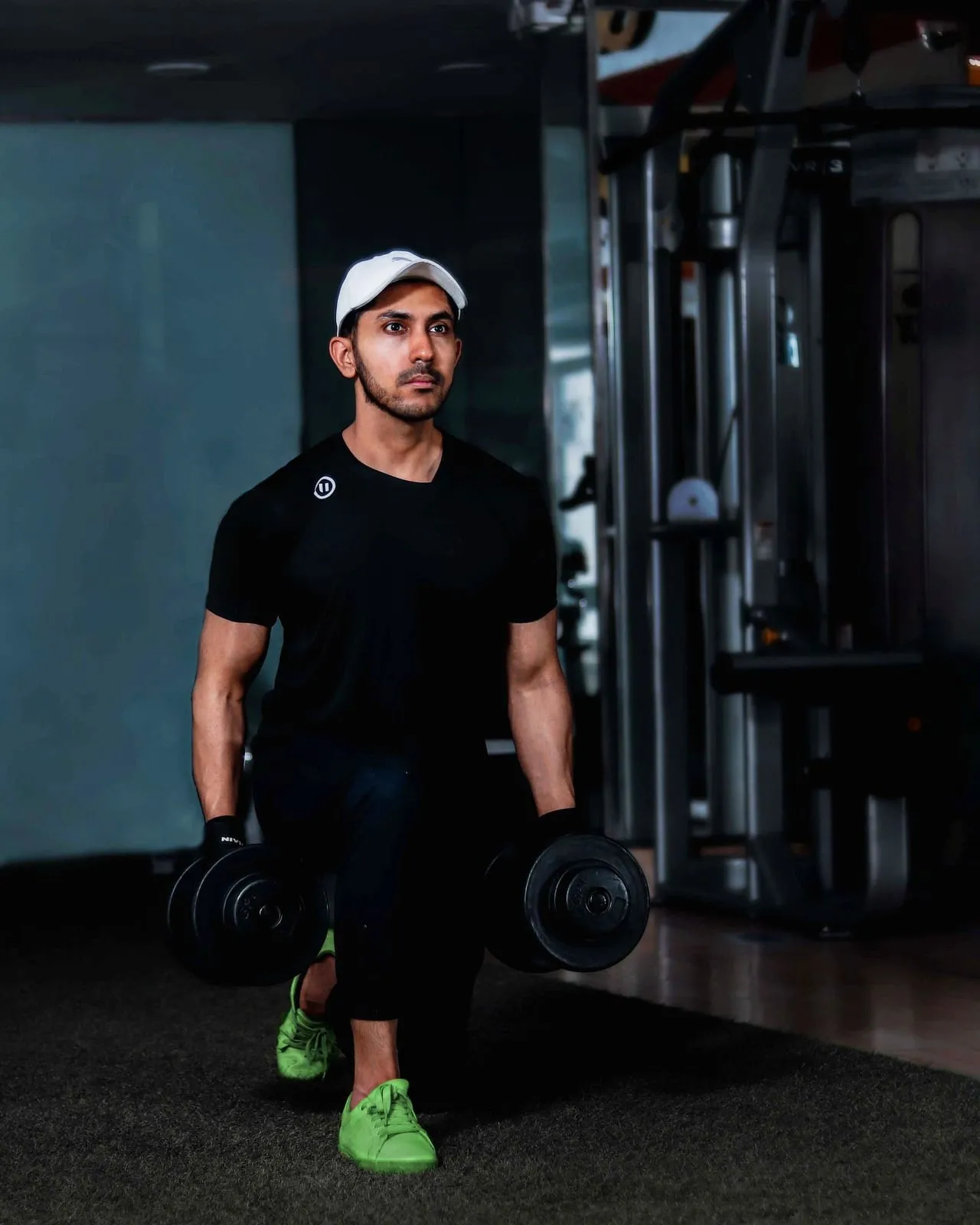 Strength trainer Arjun Thapa holding dumbbells