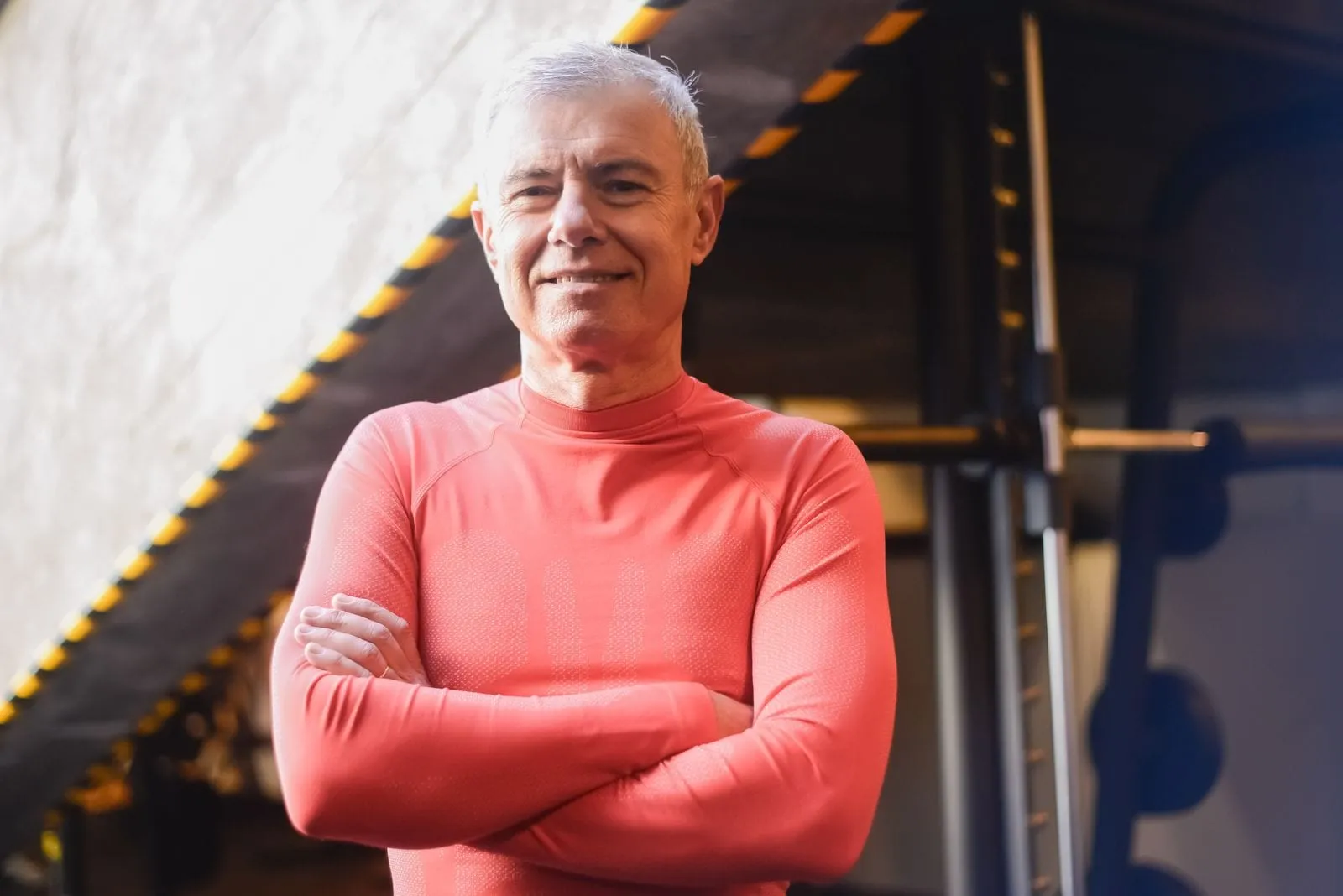 David standing with his arms crossed in the gym