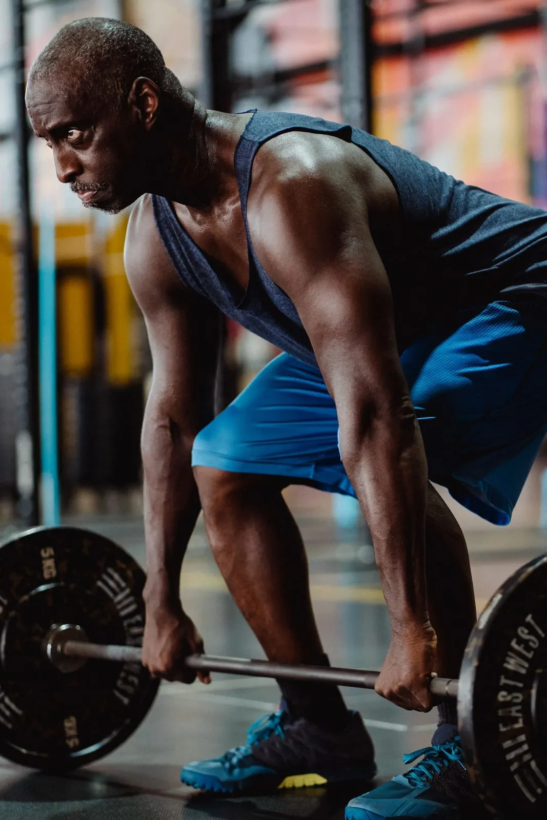 Krishna setting up for a barbell deadlift