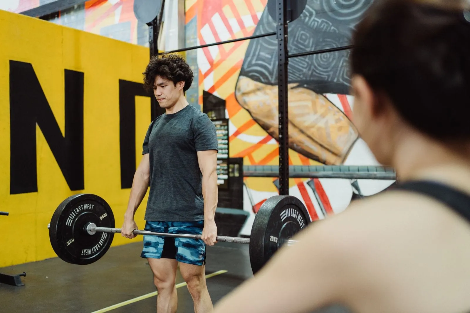 Sagar setting up for a deadlift on the platform