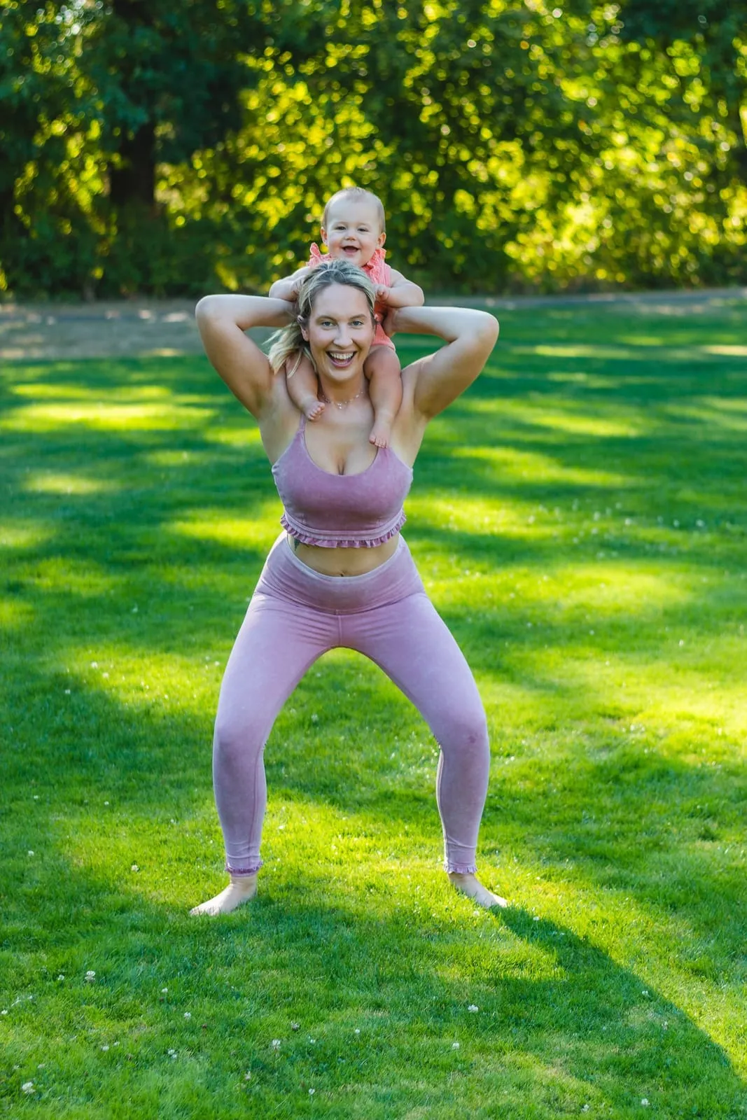 Tara holding a deep bodyweight squat outdoors